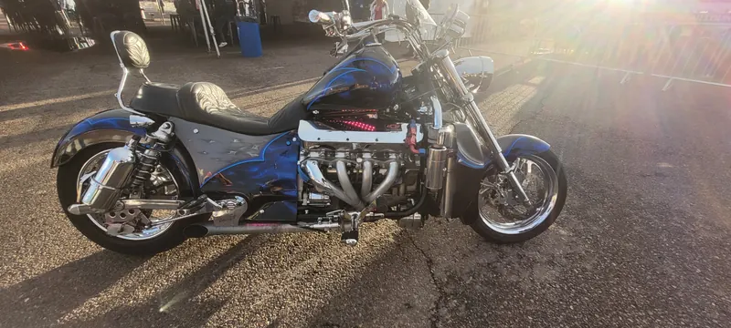 Blue V8-powered motorcycle in the outdoor show area at Arizona Bike Week 2024