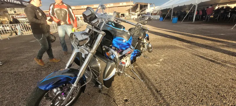 Blue V8-powered motorcycle with windshield at Arizona Bike Week 2024