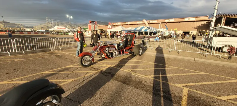 Red custom V8 trike in the outdoor show area at Arizona Bike Week 2024