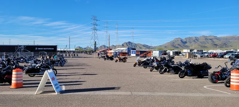 Rows of parked motorcycles with desert mountains behind them at Arizona Bike Week 2024