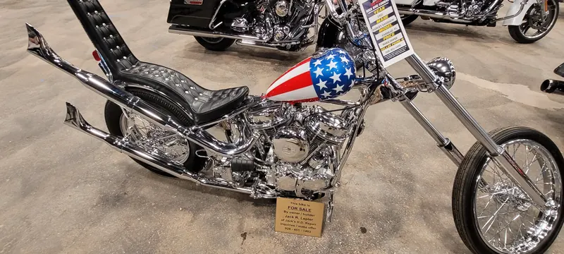 Close-up of a stars and stripes chopper tank and tall sissy bar at Arizona Bike Week 2024