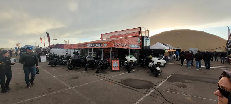Baggers parked at a vendor display on the midway at Arizona Bike Week 2024