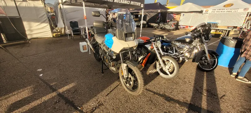 Motorcycles parked along the vendor tents at Arizona Bike Week 2024