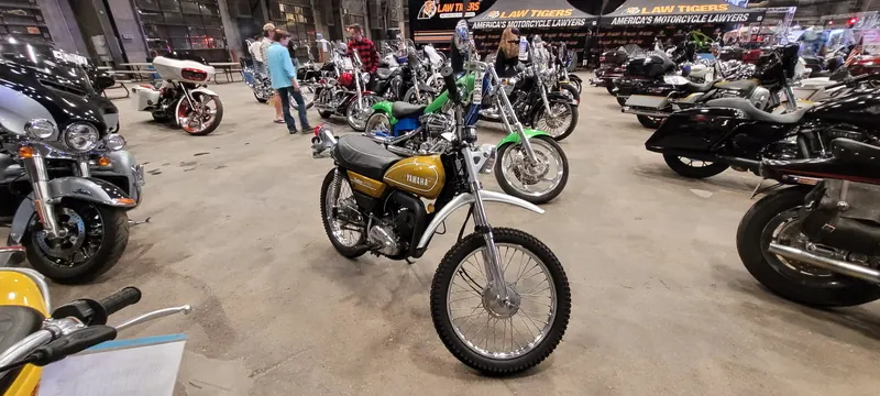 Vintage gold Yamaha enduro among rows of bikes at Arizona Bike Week 2024
